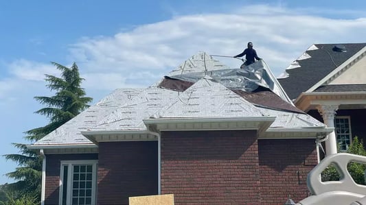 Tarp coming off of roof_WebP