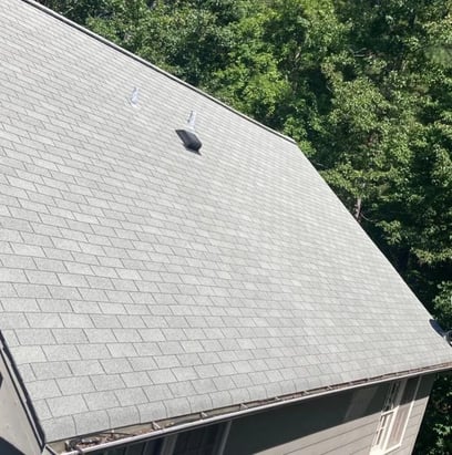 Three-tab asphalt shingles on a residential roof