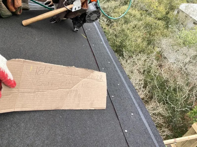 Self-adhered peel-and-stick starter strip being installed along the roof edge on a FORTIFIED roof in North Carolina