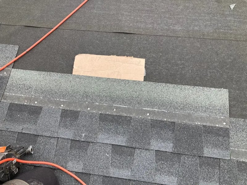 Architectural shingles being installed to a high-wind nailing pattern on a FORTIFIED roof in North Carolina