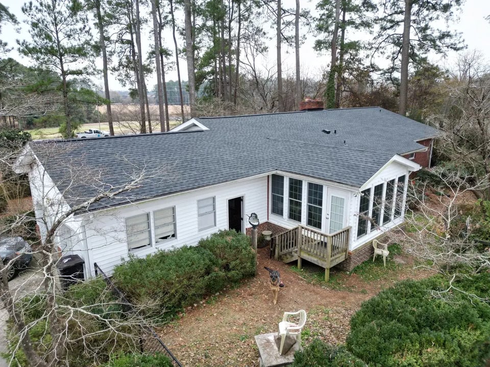 Completed roof replacement on an Angier home along NC-210 with new GAF Timberline HDZ Charcoal architectural shingles