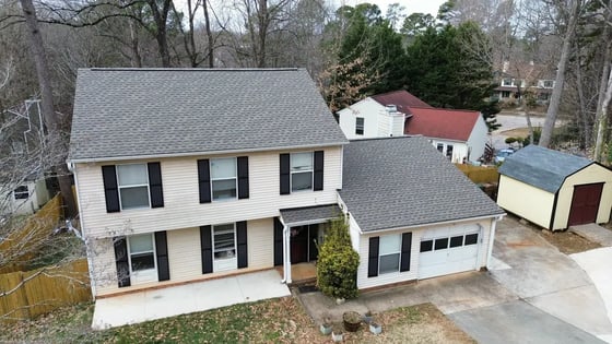 Weathered Wood GAF HDZ shingles on a cream two-story home in Cary