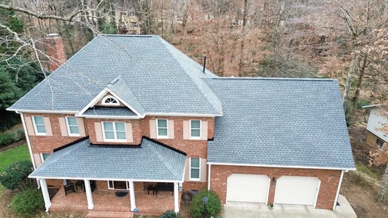 Pewter Gray GAF HDZ shingle roof on a large all-brick home near MacGregor Downs in Cary