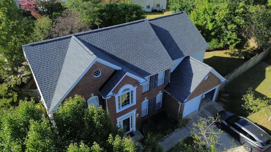 Pewter Gray GAF HDZ shingles on a warm brown brick home in Cary