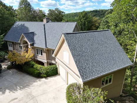 Aerial view of completed CertainTeed Pewter Gray roof on a large Chapel Hill home at 39413 Glenn Glade in Governors Club