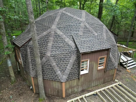 Overhead completed dome roof on a Chapel Hill home on Hawk Ridge Rd with new Barkwood GAF UHDZ shingles in geometric pattern