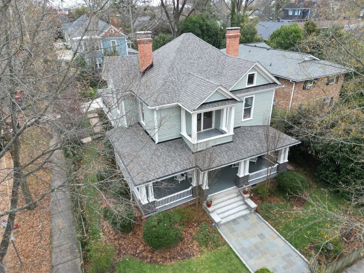 Front-facing view of a completed On Tops Roofing project in Durham, NC with new Weathered Wood CertainTeed Landmark shingles on a central Durham home