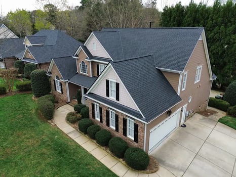 Charcoal GAF Timberline HDZ shingles on a large home on Heather Bluffs Dr in Garner