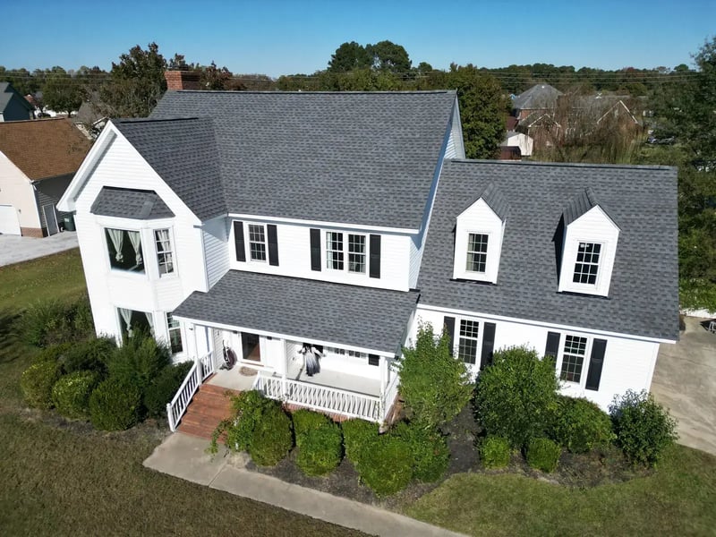 Completed roof replacement on a two-story home in Goldsboro, NC — front elevation