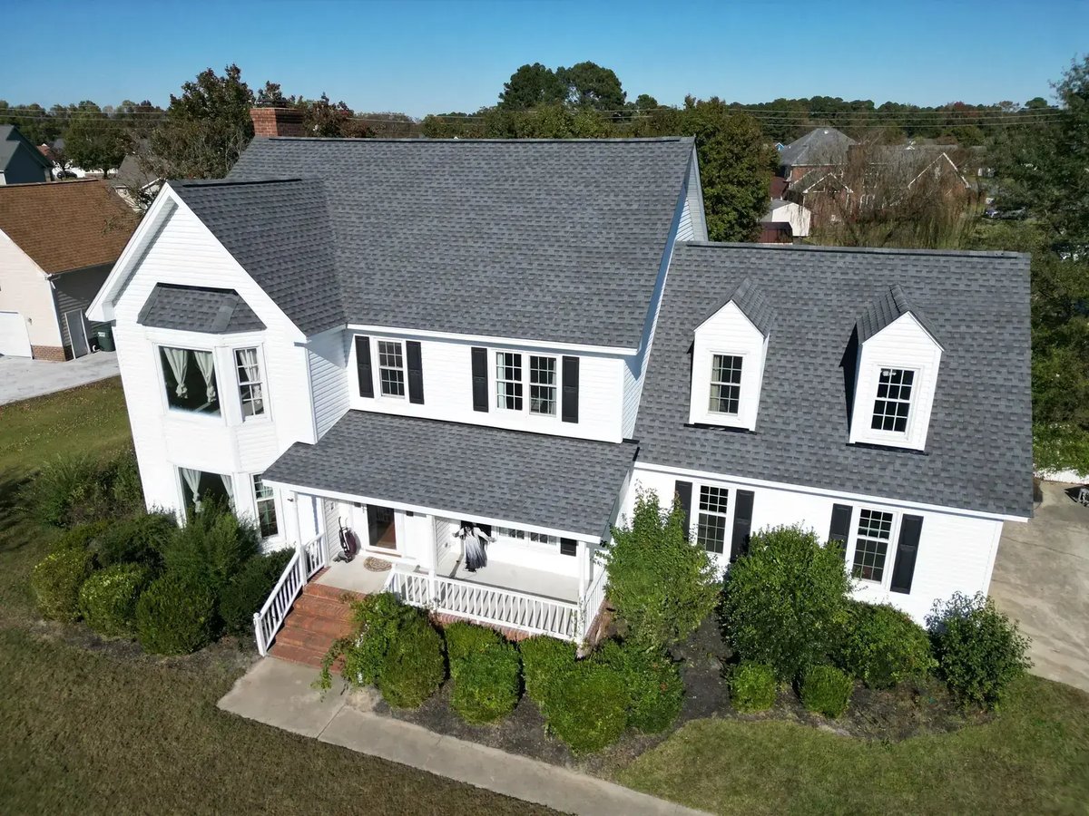 Completed roof replacement on a two-story home in Goldsboro, NC — front elevation