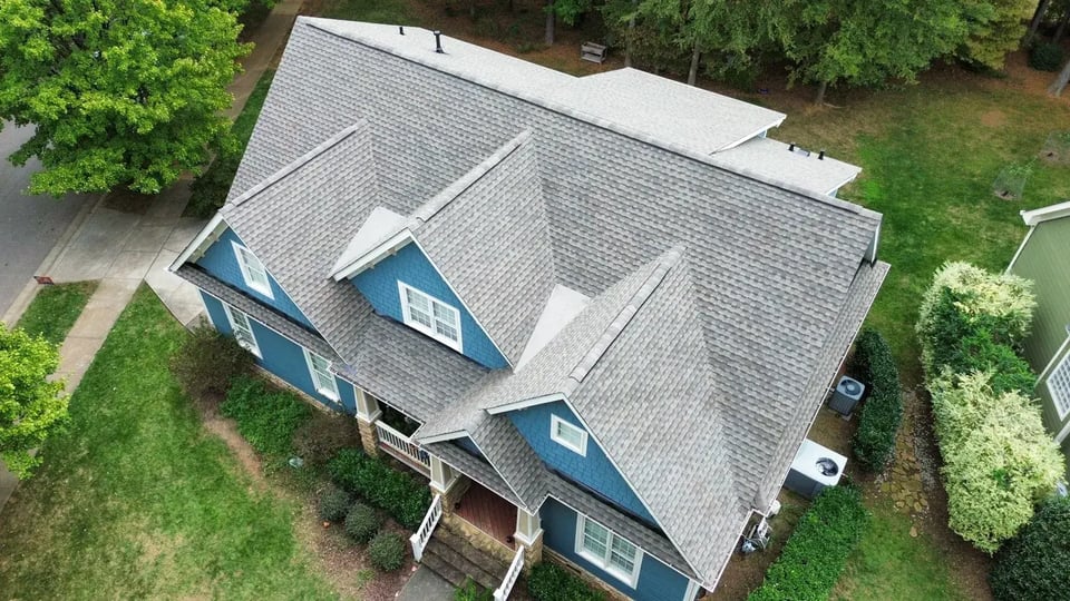Completed roof replacement on a Holly Springs home on Chrismill Ln with new GAF Timberline Ultra HDZ Weathered Wood architectural shingles