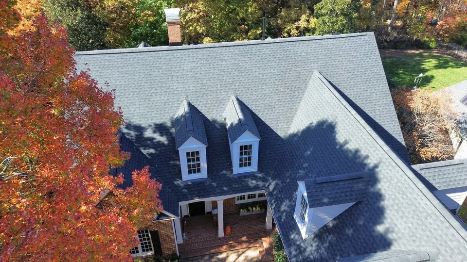 Completed roof replacement on a Raleigh home on Carlton Square Place with new charcoal GAF architectural shingles