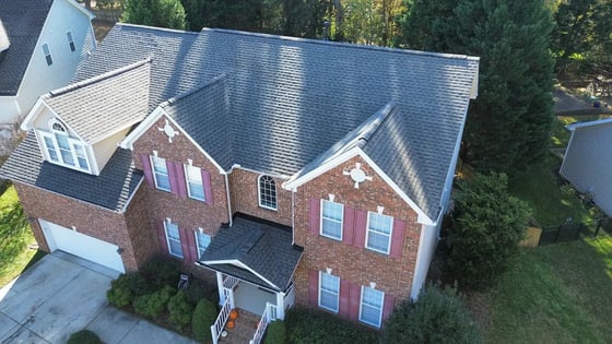 Weathered Wood GAF HDZ shingles on a two-story all-brick Raleigh home on Debmoor Place