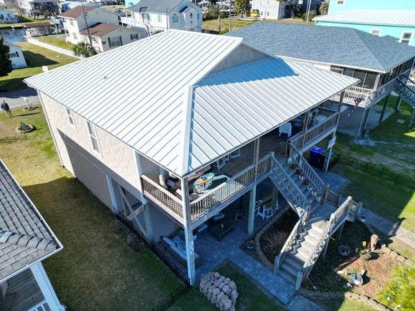 Completed standing-seam metal roof replacement at 7th St, Surf City NC