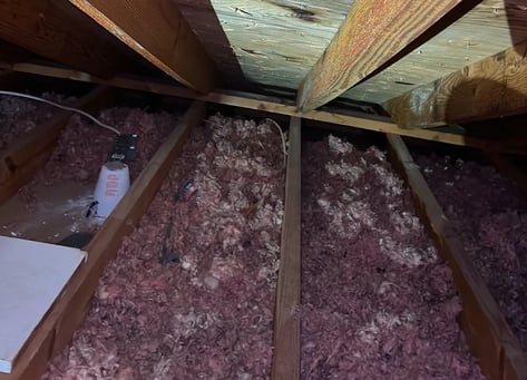 Spray foam insulation applied to the underside of a roof deck in an unvented attic