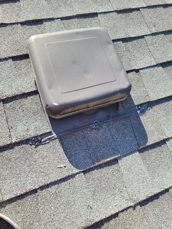 Attic ventilation fan installed on a roof
