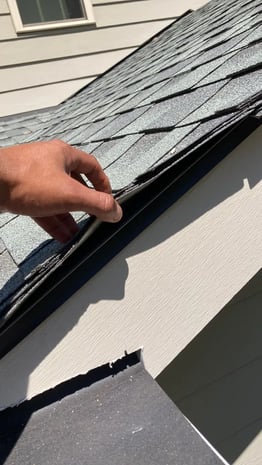 Black drip edge along the edge of a roof
