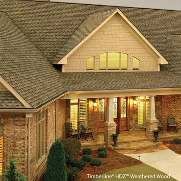 brown architectural asphalt shingles on a beige brick house_WebP