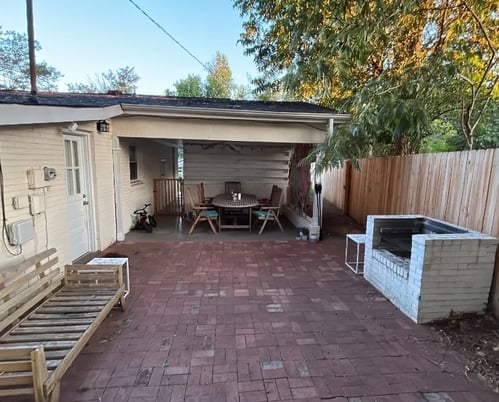 Cleared patio prepared for a roof replacement