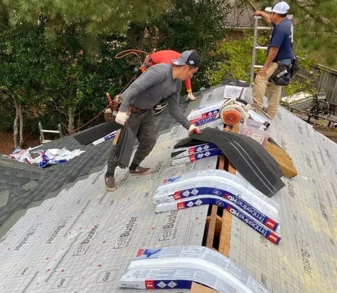 Roofing contractors installing a new roof