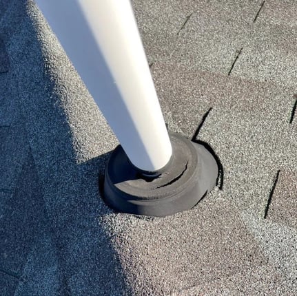 Cracked rubber pipe boot on a roof