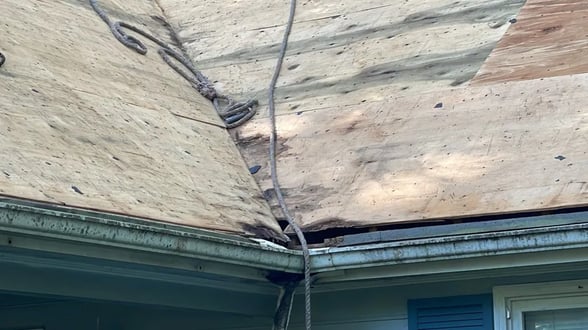 Damage in a roof valley where two slopes meet