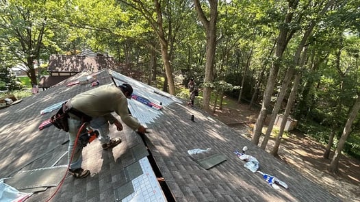 Roofing crew working on a residential roof