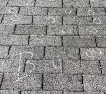 Hail damage on asphalt shingles after a storm