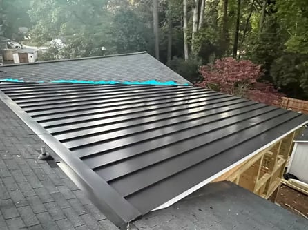 A standing seam metal low-slope roof