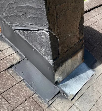 Aging flashing reused on a roof