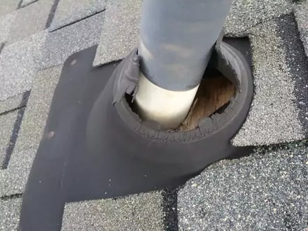 A worn pipe boot in need of repair