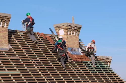 roofing contractors working on a roof replacement