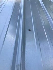 screws coming out of EF metal roof_WebP