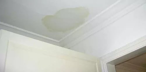 A stained ceiling from a roof leak