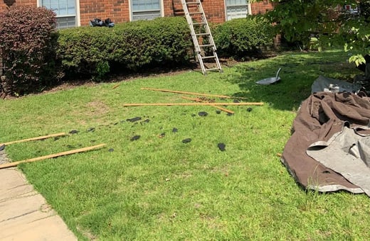 Yard around a home during a roof replacement