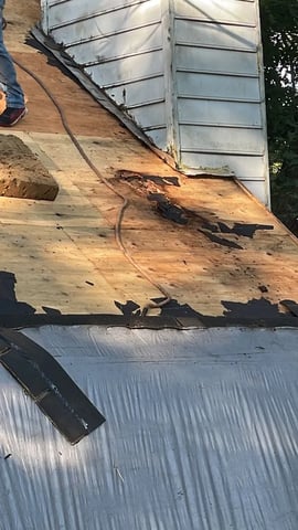 Water damage on a ceiling near a chimney