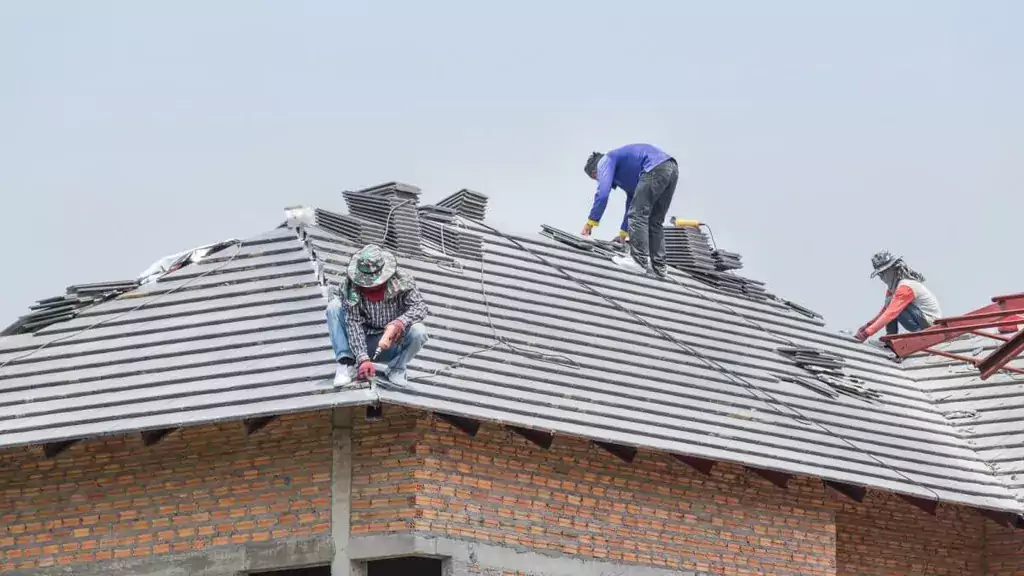 Men on a roof conducting a roof replacement