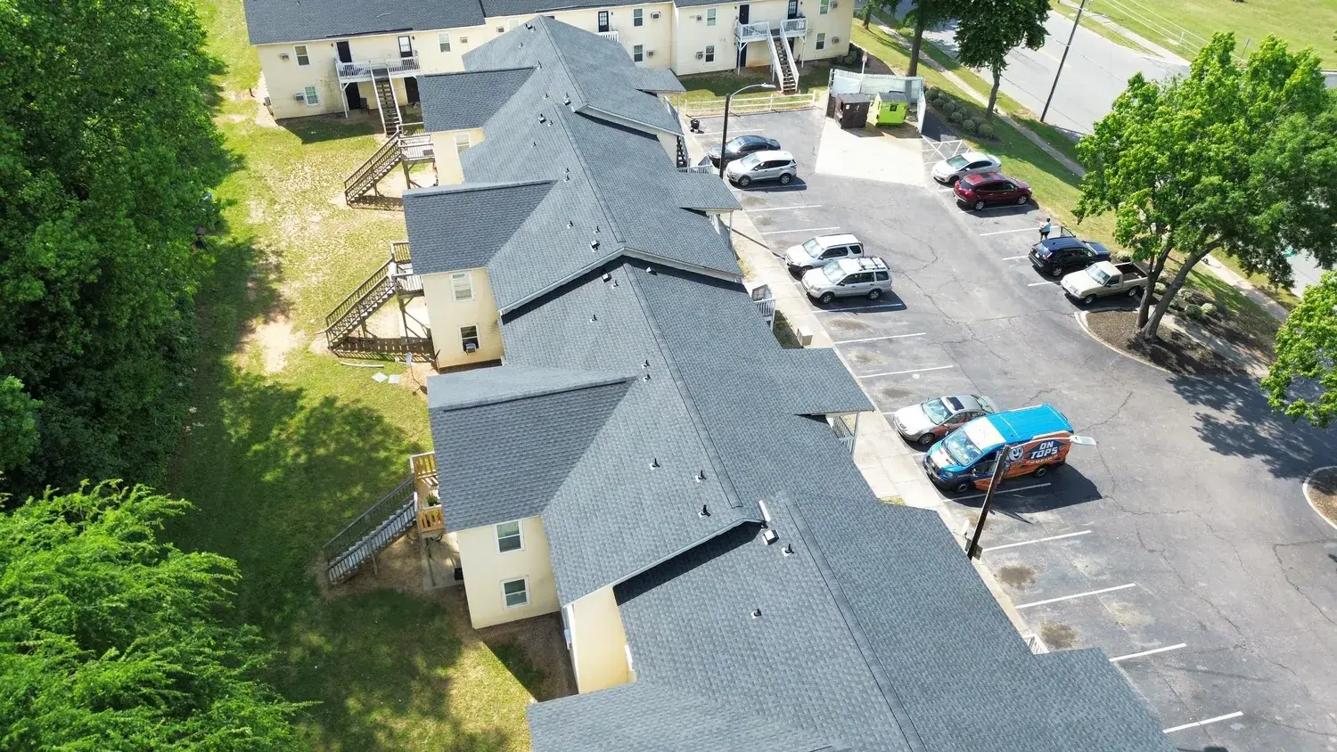 On Tops Roofing crew working on an apartment roof replacement