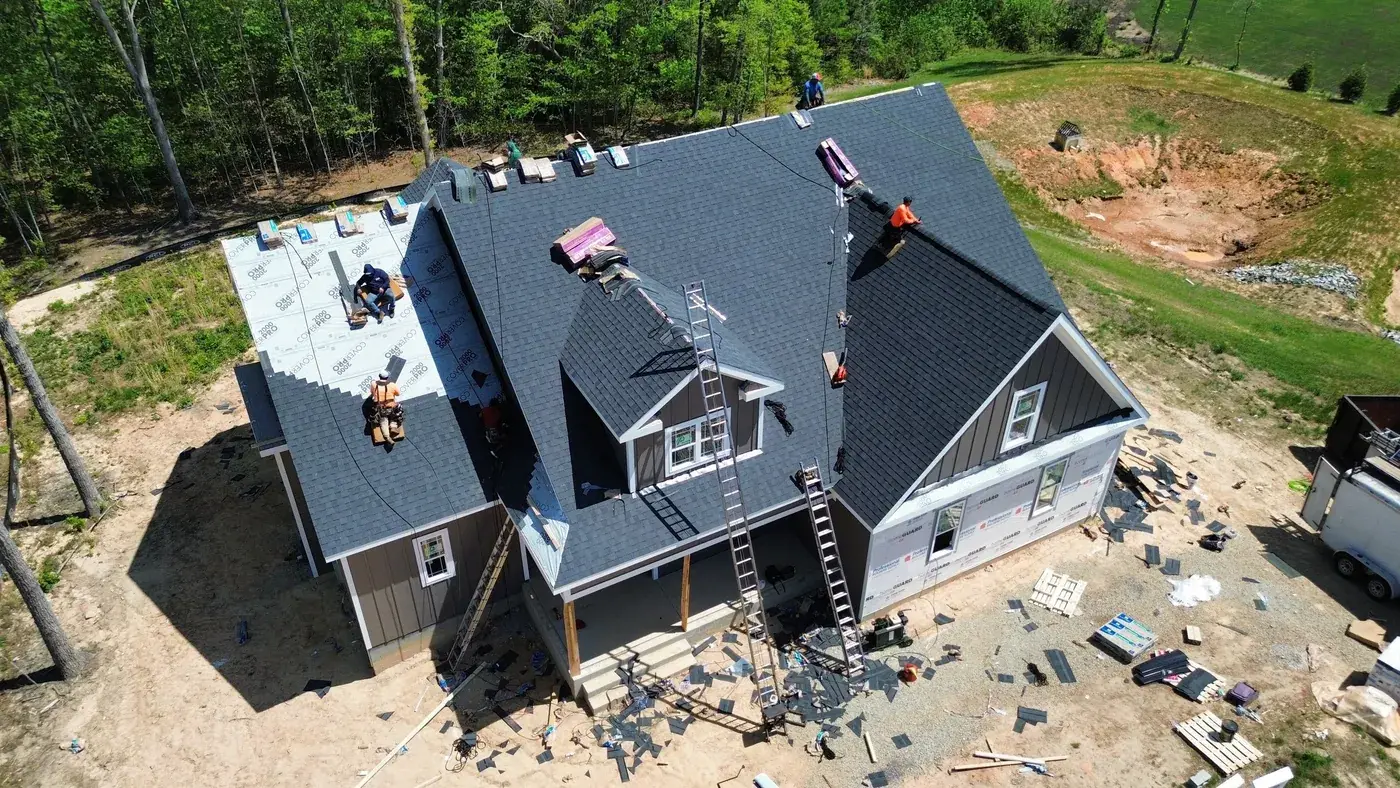 New construction home with freshly installed asphalt shingle roof