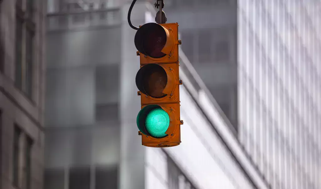 green-traffic-lights-for-cars-blur-office-buildin-2021-08-26-16-34-39-utc_WebP